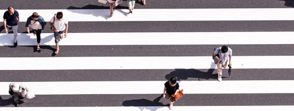 overhead shot of people in a pedestrian crossing